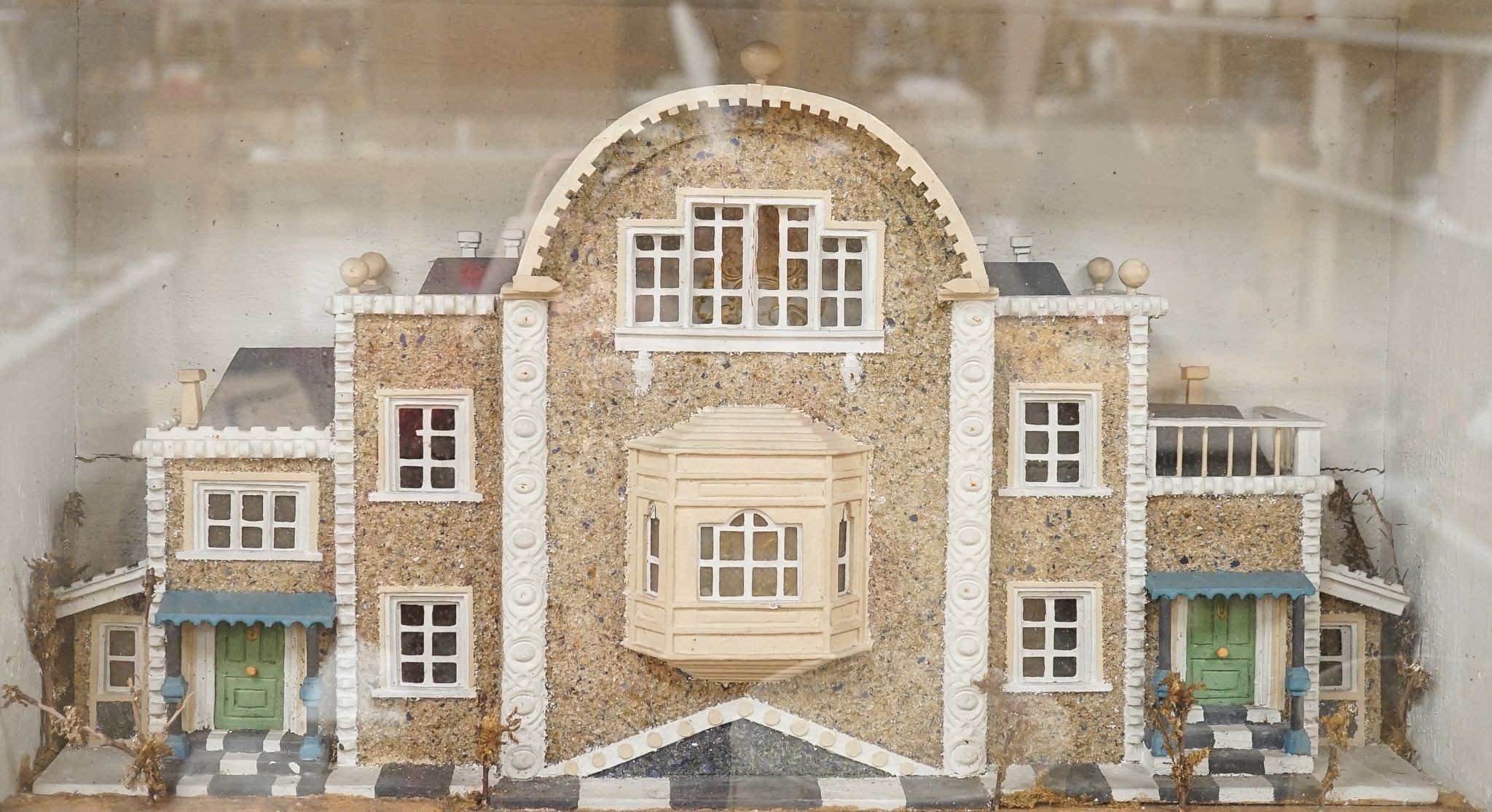 A diorama of a country house, case 63 cm wide